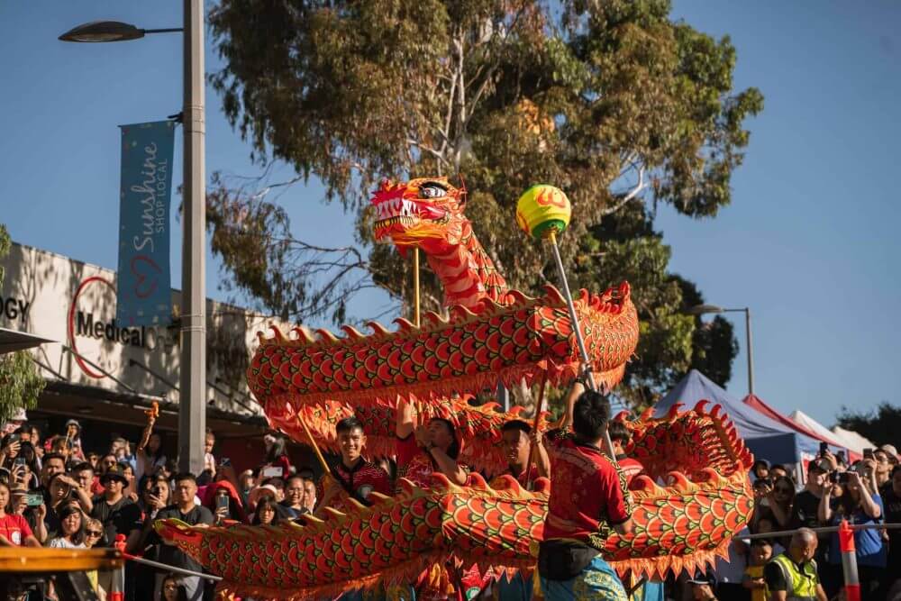 Performers holding up a traditional Chinese dragon costume