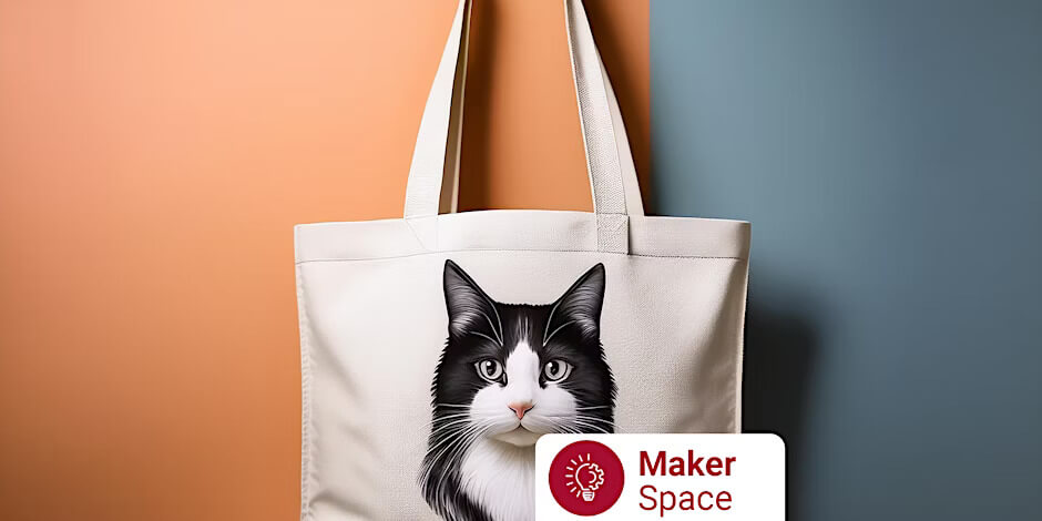 A tote bag with a black and white cat picture on it